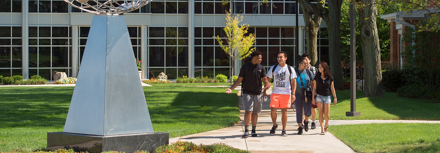 Students walking across campus in a group