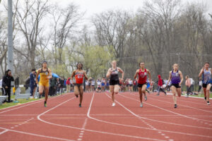 Indiana Tech track athletes running against visiting teams on the outdoor track