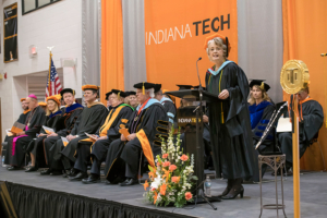 Previous faculty of the year Sherrill Hamman speaking at the Inauguration of President Karl W. Einolf